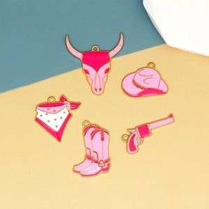 Pink and gold western cowgirl enamel charms set featuring hat, boots and bull skull