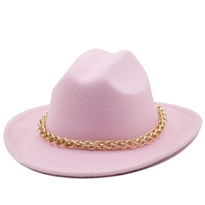 Detail of pink wool felt cowboy hat featuring a bold glossy gold chain accessory