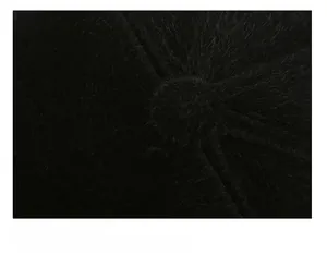 Detailed macro view of the stitching and plush texture on a black winter flat top hat