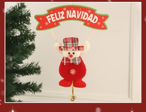 Detail of Christmas reindeer ornament with Feliz Navidad banner and golden bell charm