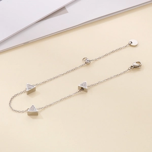 Detailed close-up of a silver triangle rhinestone bracelet with lobster clasp and adjustable chain