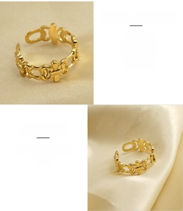 Detailed macro view of 18K gold-plated stainless steel hollow pattern open rings