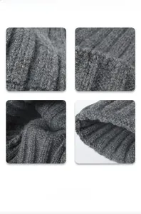Detail showing the thick rib-knit texture and soft fuzzy wool yarn of the dark grey beanie