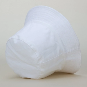 Close-up of white cotton bucket hat featuring reinforced stitching and minimalist texture
