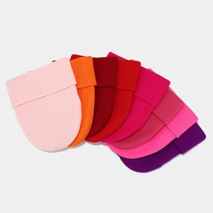 Flat lay detail showing eight vibrant color options of the ribbed knit beanie hats