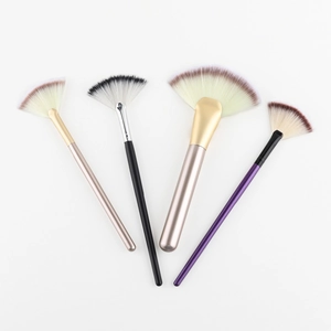 Set of four professional fan highlighter brushes with assorted colored handles and soft bristles
