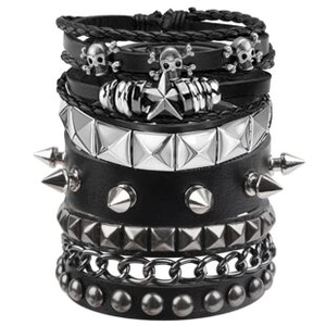 Macro detail of multi-layer punk leather bracelets with metal studs and skull charms