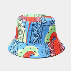 Close-up of vibrant tie-dye paisley print and detailed stitching on the reversible bucket hat