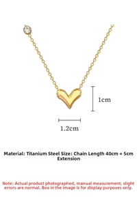 Close-up of gold heart pendant with zircon on a stainless steel chain with dimensions