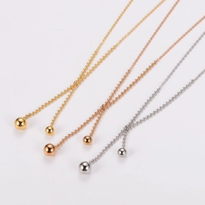 Minimalist beaded Y-necklace with gold, silver and rose gold metallic ball pendants