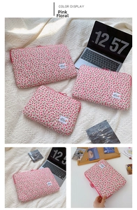 Detail showing pink floral laptop sleeve sizes with protective quilted fabric padding