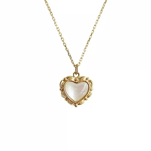 French vintage gold heart pendant necklace with shell inlay and retro embossed edges