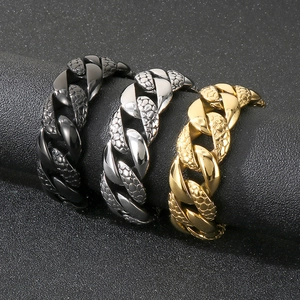 Detail of 25mm pebble-textured Cuban link bracelets in black, silver, and gold finishes