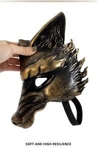 Detail view of the soft wolf mask showing high resilience texture in gold and black