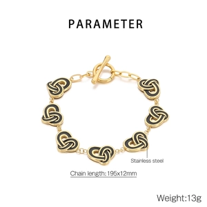 Macro detail of stainless steel heart toggle bracelet showing 195x12mm size and 13g weight