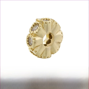 Detailed view of gold plated brass honeycomb bead with cubic zirconia for DIY jewelry