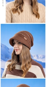 Detail of dark brown knit beanie with silver glitter stripes and faux leather logo label