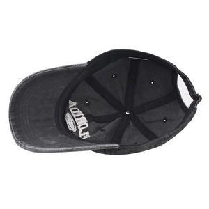Detail of internal reinforced stitching and metal adjustable buckle on washed cotton cap