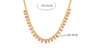 Detail of gold titanium necklace with pink oil drip bead and 42+5cm extension chain