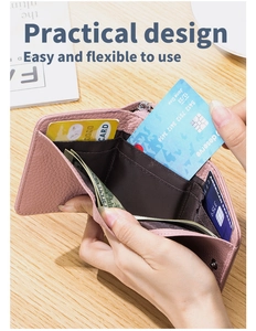 Pink leather tri-fold wallet detail showing card slots and large bill compartment