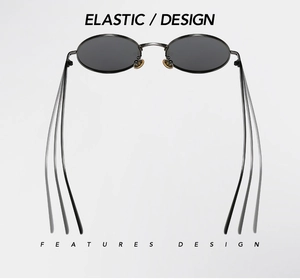 Detail view of round punk sunglasses featuring flexible metal temples and grey lenses