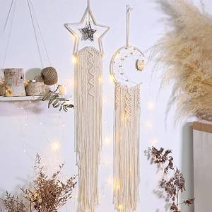 Handmade boho macrame moon and star wall decor with warm LED lights for home nursery