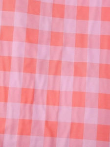 Close-up of high-quality pink and orange checkered fabric texture with clear woven details
