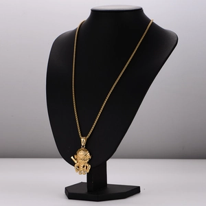 Golden Monkey King pendant necklace on black bust display for men's fashion jewelry