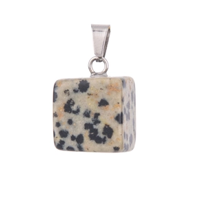 Close-up of square Dalmatian Jasper stone pendant with metal bail on white background