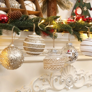 9-piece 8cm Christmas ball ornament set with gold and lace textures on a festive mantel
