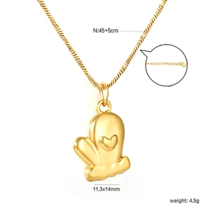 Detail view of 18K gold glove necklace pendant with size 11.3x14mm and weight 4.5g