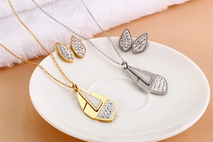 Detail of 18K gold and silver plated geometric jewelry sets with crystals and mother of pearl