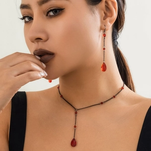 Gothic red crystal blood drop necklace and earrings set on model with black metal chain