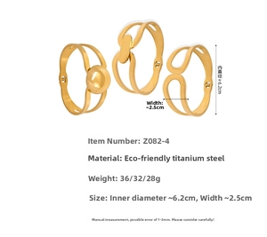 Detailed view of three gold titanium steel bangles with hollow geometric and ring designs