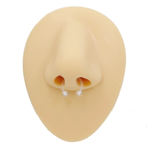 Detailed view of clear acrylic horseshoe nose ring on flesh-tone piercing model