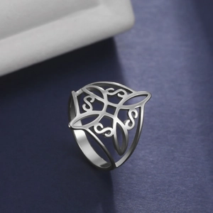 Sleek stainless steel witch knot ring featuring silver openwork Celtic patterns
