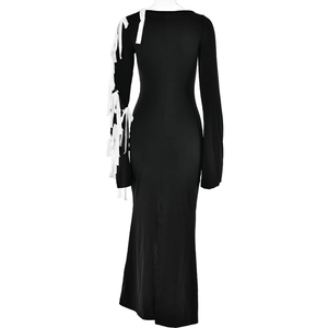 Detailed back view of a black maxi dress featuring white lace-up ribbon sleeve details