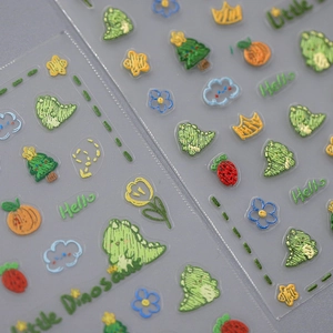 TENSOR ultra-thin nail stickers with embroidery texture featuring cartoon dinosaur motifs