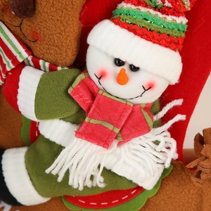 Christmas stocking gift bags with reindeer and snowman plush decorations for holiday decor