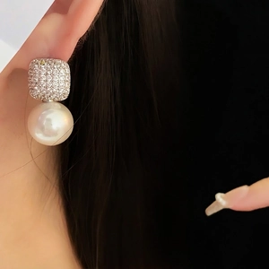 Elegant zircon square pearl drop earrings on model for a minimalist luxury look