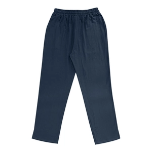 Detail of navy blue linen trousers showing elastic waistband and natural fiber texture