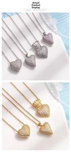 Close-up of heart crown pendants with micro-pave cubic zirconia on delicate chains