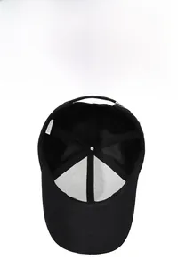Detail view of the breathable mesh lining and inner cotton band of a black baseball cap