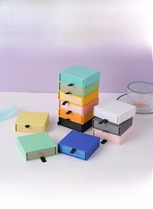 Multi-colored jewelry drawer gift boxes with black ribbon pull tabs and sliding mechanism