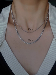 Comparison of 45cm and 50cm silver chain necklaces shown on neck for length reference