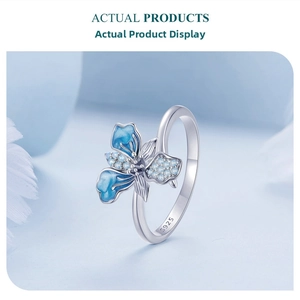 Macro detail of S925 sterling silver stamp and blue enamel iris flower ring