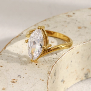 Detailed shot of an 18K gold plated ring with a marquise-cut white zircon on stone