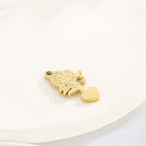 Detailed close-up of a 3D golden Cupid angel pendant with a heart on a white background