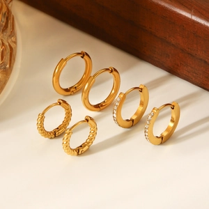 Three-piece set of 18K gold plated stainless steel hoops featuring twisted and paved designs