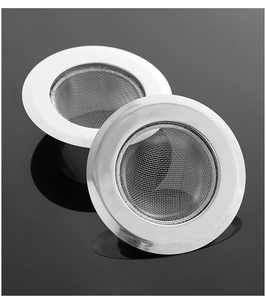 Close-up of two stainless steel kitchen sink strainers with fine mesh on black surface